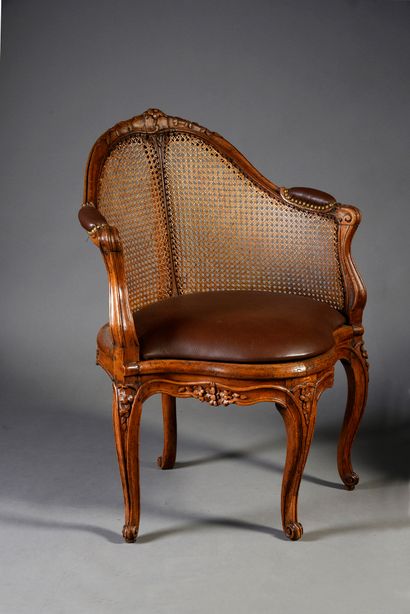 null Cabinet armchair with cane bottom in molded and carved beech.
Axial leg with...