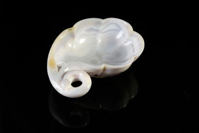 null Libatory cup carved in white agate and jaspered resting on a small foot engraved...