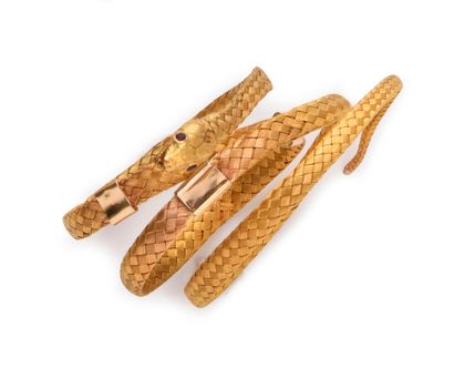 null Bracelet in braided gold 750th (18k), stylizing a coiled snake, the mouth open,...