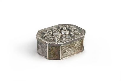 null Silver box, rectangular shape with cut sides. The body is embossed and chiseled...