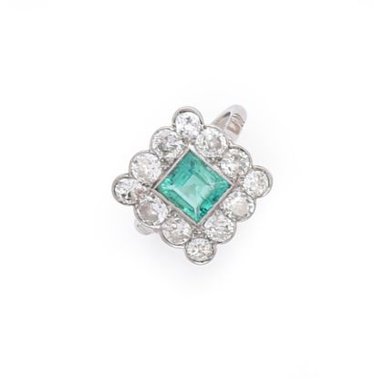 null 850th platinum ring set with a square emerald in a beaded closed setting, in...