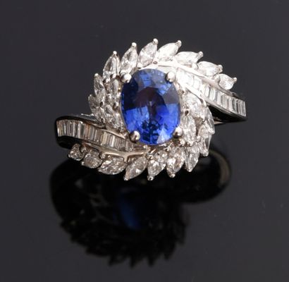 null Tourbillon ring in 18k white gold set with an oval faceted Ceylon sapphire (approx....