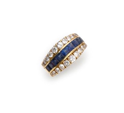 null Gold ring 750th (18k) decorated with a line of calibrated sapphires on a rail...