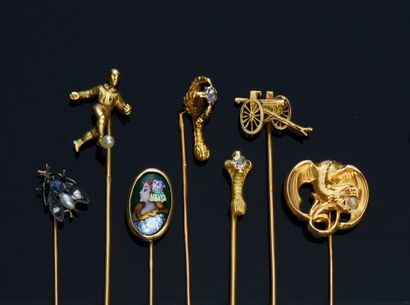 null Six tie-pins in gold 750e, decorated with an oval plate of enamel of Limoges,...