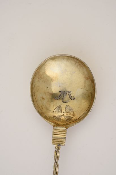 null Silver spoon gilt, the stem partially twisted ended by a crowned sphere. Engraved...