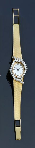 null Ladies' watch in 18k gold, the oval dial set with round and navette diamonds...