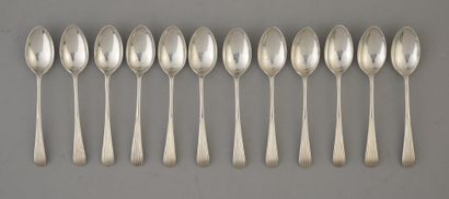 null Set of twelve English silver mocha spoons, the spatula chased with fillets.
England,...