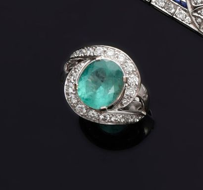 null Ring in 18k white gold set with a 3.49-carat Colombian emerald in a scrolled...