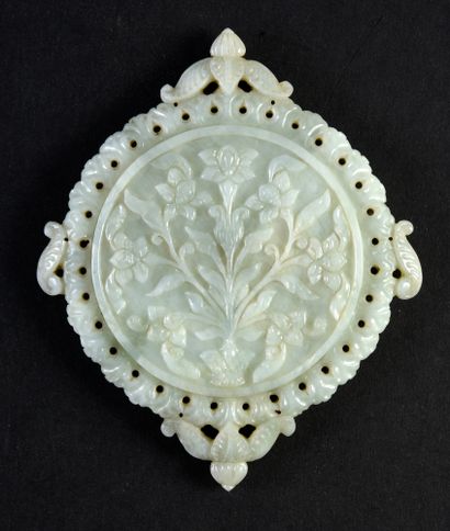 null Indian circular mirror in celadon nephrite jade framed by four boteh holds and...