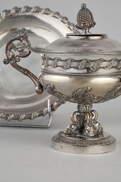 null Covered cup and its saucer in silver finely chased and decorated on the body...
