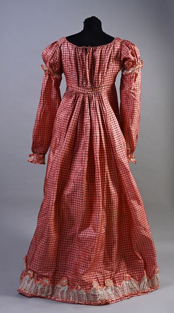 null Afternoon dress, circa 1820, high-waisted dress with flowing neckline in black...