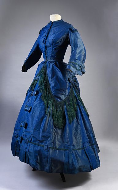 null Afternoon dress, circa 1860, blue change silk taffeta; stapled bodice trimmed...