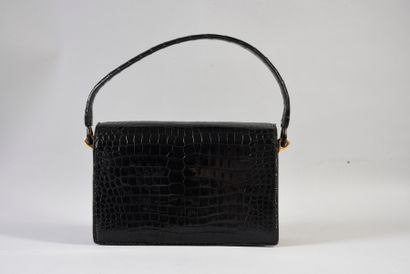 null HERMES

Black crocodile bag with beading decoration circa 1950-1960, gilt metal...