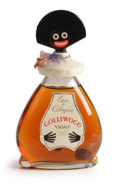 VIGNY «Le Golli-Wogg» - (1918) Version «eau de cologne» en verre incolore pressé...
