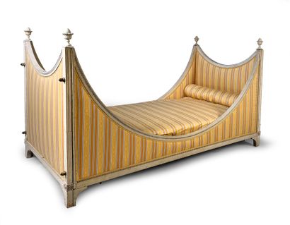 null Pair of carved and molded beechwood beds, lacquered light gray. The uprights...