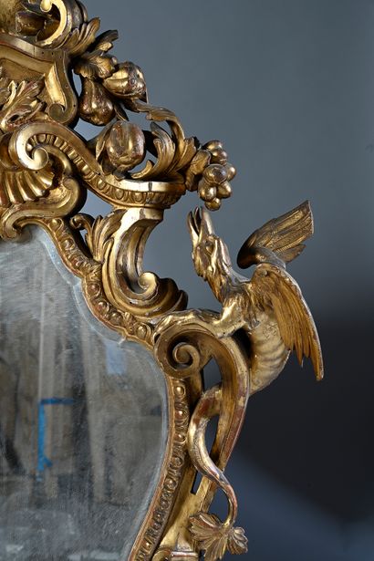 null Rare pair of gilded wood rocaille mirrors, richly carved and openwork. The frame...