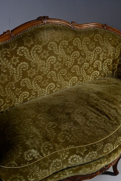 null Small basket sofa in molded and carved walnut, decorated with foliage, flowers...