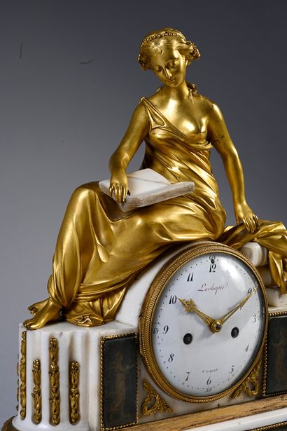 null Clock with the study in chased and gilded bronze. The female figure with a book...