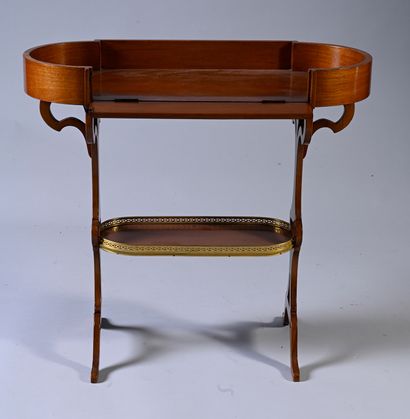 null Mahogany and mahogany veneer table, the top with rounded ends and a high "trough"...