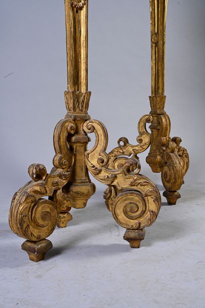 null Pair of large carved and gilded wood torchieres, the round gilded tray rests...
