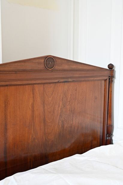 null Mahogany and mahogany veneer bed, molded and carved, the headboards with pediments...