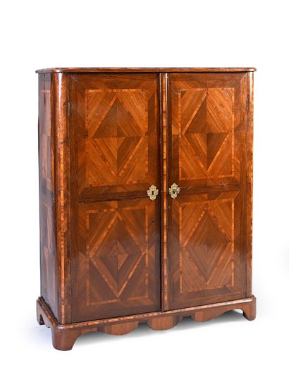 null Small rectangular cabinet in violet and rosewood veneer, opening with two doors...