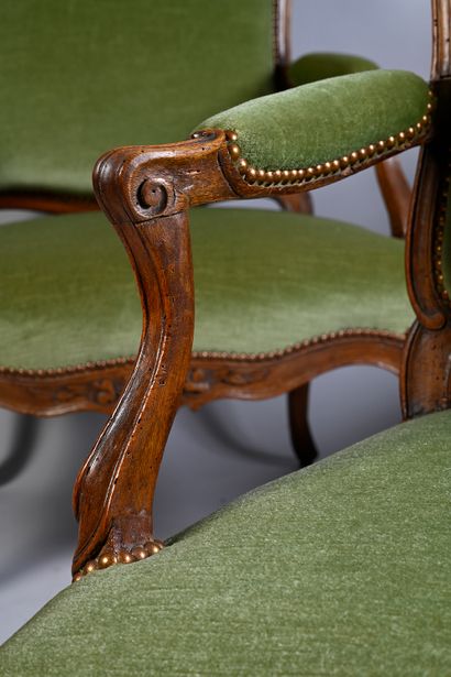 null A molded and carved walnut shepherd's chair decorated with flowers and foliage,...