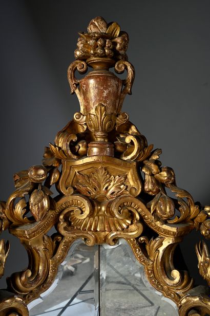 null Rare pair of gilded wood rocaille mirrors, richly carved and openwork. The frame...