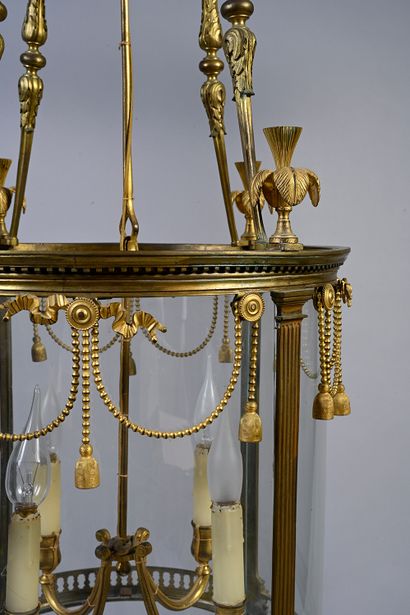 null Lantern with four arms of light in chased and gilded bronze, of circular form,...