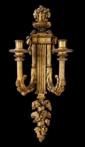 null Pair of gilded wood sconces, the central shaft in the form of a pilaster is...