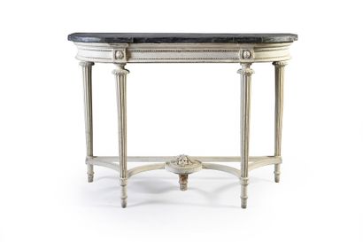 null A carved, molded and white lacquered wood half-moon console, the rounded belt...