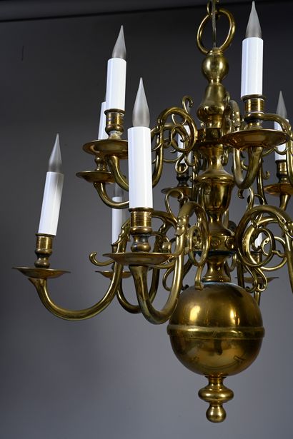 null A Dutch style ormolu chandelier with twelve lights, the baluster shaft supporting...