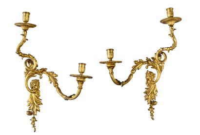 null Pair of chased and gilded bronze sconces, with two scrolled arms of acanthus...