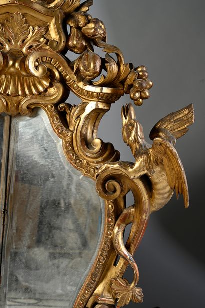 null Rare pair of gilded wood rocaille mirrors, richly carved and openwork. The frame...