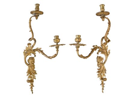 Pair of sconces in chased and gilded bronze,...