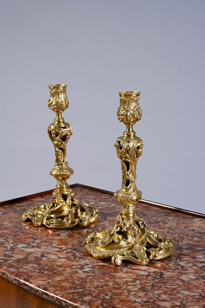 null Pair of ormolu and openwork torches with rocaille decoration of flowers, scrolls,...