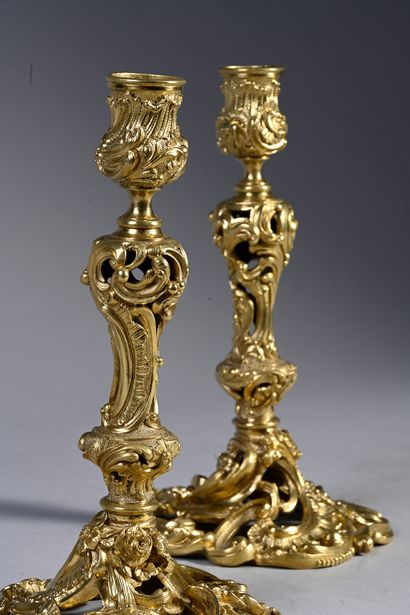 null Pair of ormolu and openwork torches with rocaille decoration of flowers, scrolls,...