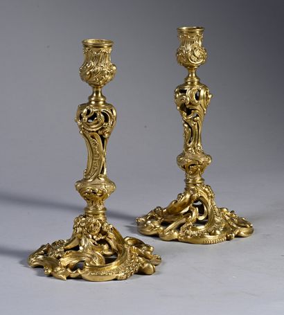 null Pair of ormolu and openwork torches with rocaille decoration of flowers, scrolls,...