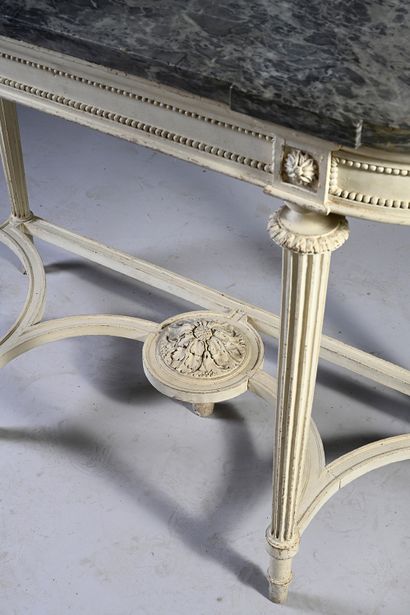 null A carved, molded and white lacquered wood half-moon console, the rounded belt...