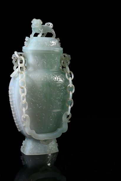 CHINE, XXe siècle Rare jadeite covered vase, the body with a delicate decoration...