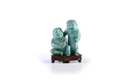 CHINE, XXe siècle Carved turquoise group representing the twins
Hehe Erxian
Height...