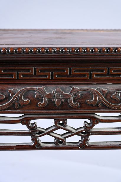 CHINE, XIXe siècle Rectangular console in carved hongmu wood with scrolls and flowers,...