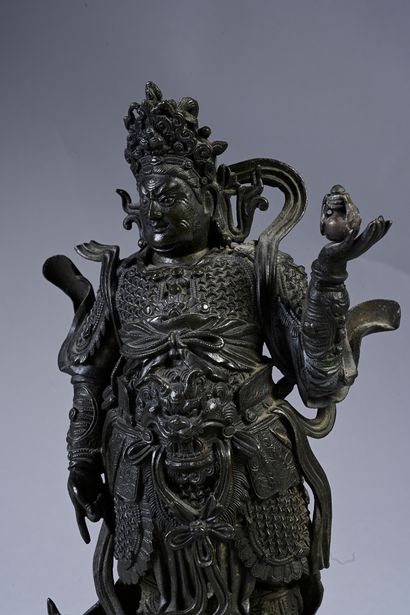 CHINE, XVIIe siècle Sculpture en bronze d'un guerrier appelé le Roi Gardien
Dhanada....
