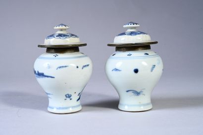 VIETNAM, XIXe siècle Two small porcelain covered potiches decorated in blue on a...