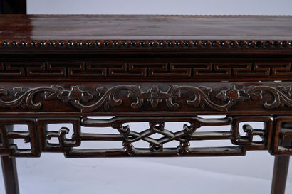 CHINE, XIXe siècle Rectangular console in carved hongmu wood with scrolls and flowers,...