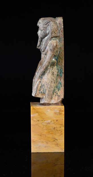 null Statuette in the name of Amenophis III in green glazed steatite.
H. 12.7 cm.
Egyptian...
