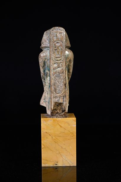 null Statuette in the name of Amenophis III in green glazed steatite.
H. 12.7 cm.
Egyptian...