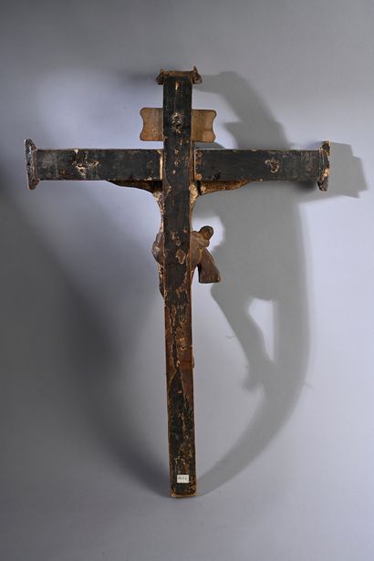null Crucifix with Christ in carved and polychromed wood. Head girded with a braided...