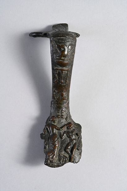 null Handle of oenochoe entirely covered with a decoration in relief including an...