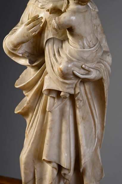 null Virgin and Child in alabaster carved in the round with gilded and engraved parts,...